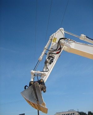 Hydraulic excavator for detection of high voltage overhead electric lines